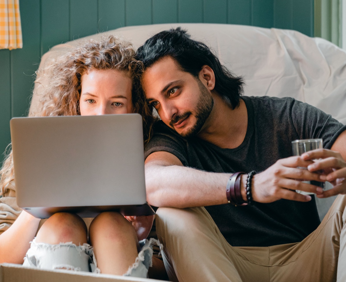 Couple planning together on a laptop